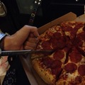 Ezio eating pizza